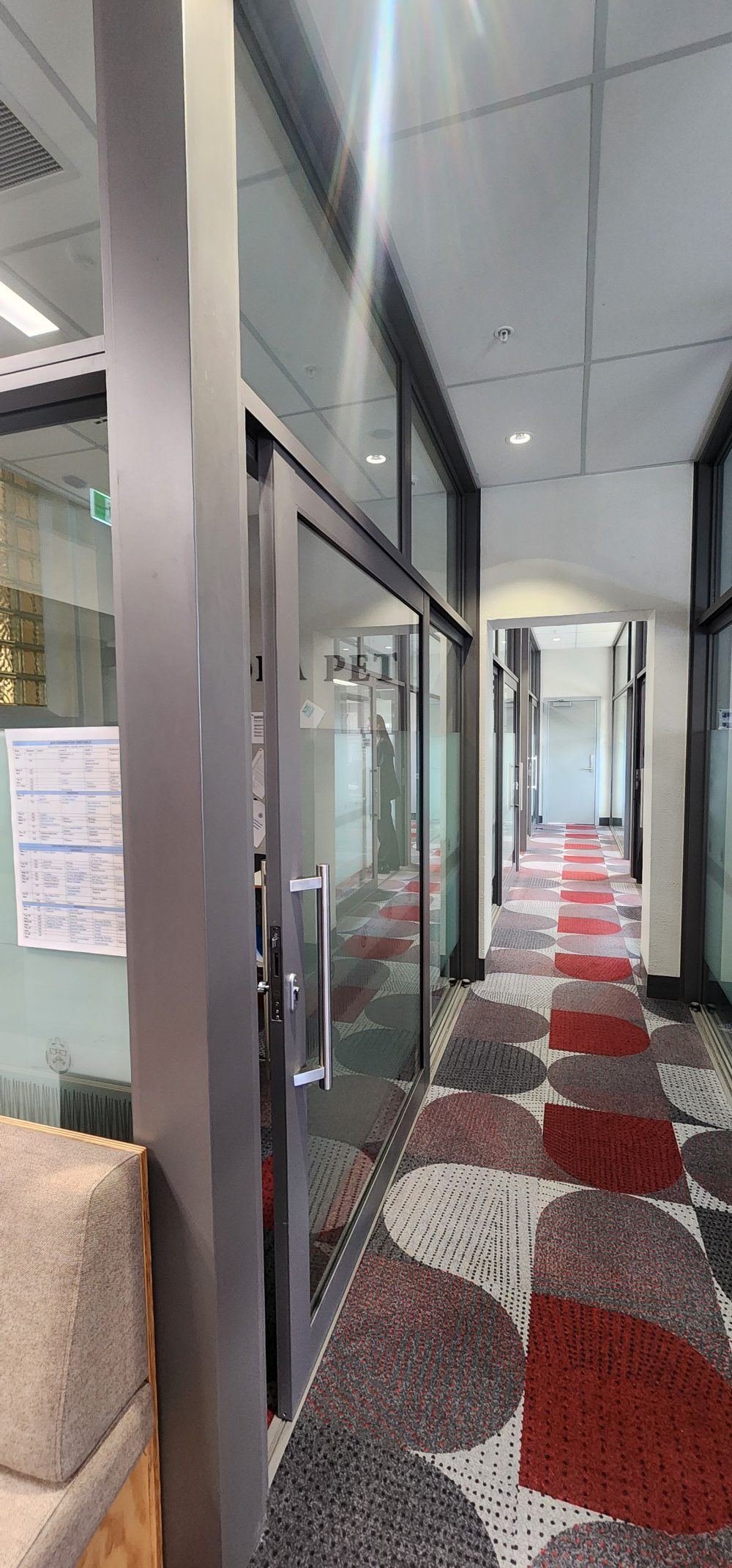 Aluminium framed glazed partitions lining a corridor at Christchurch Boys High School