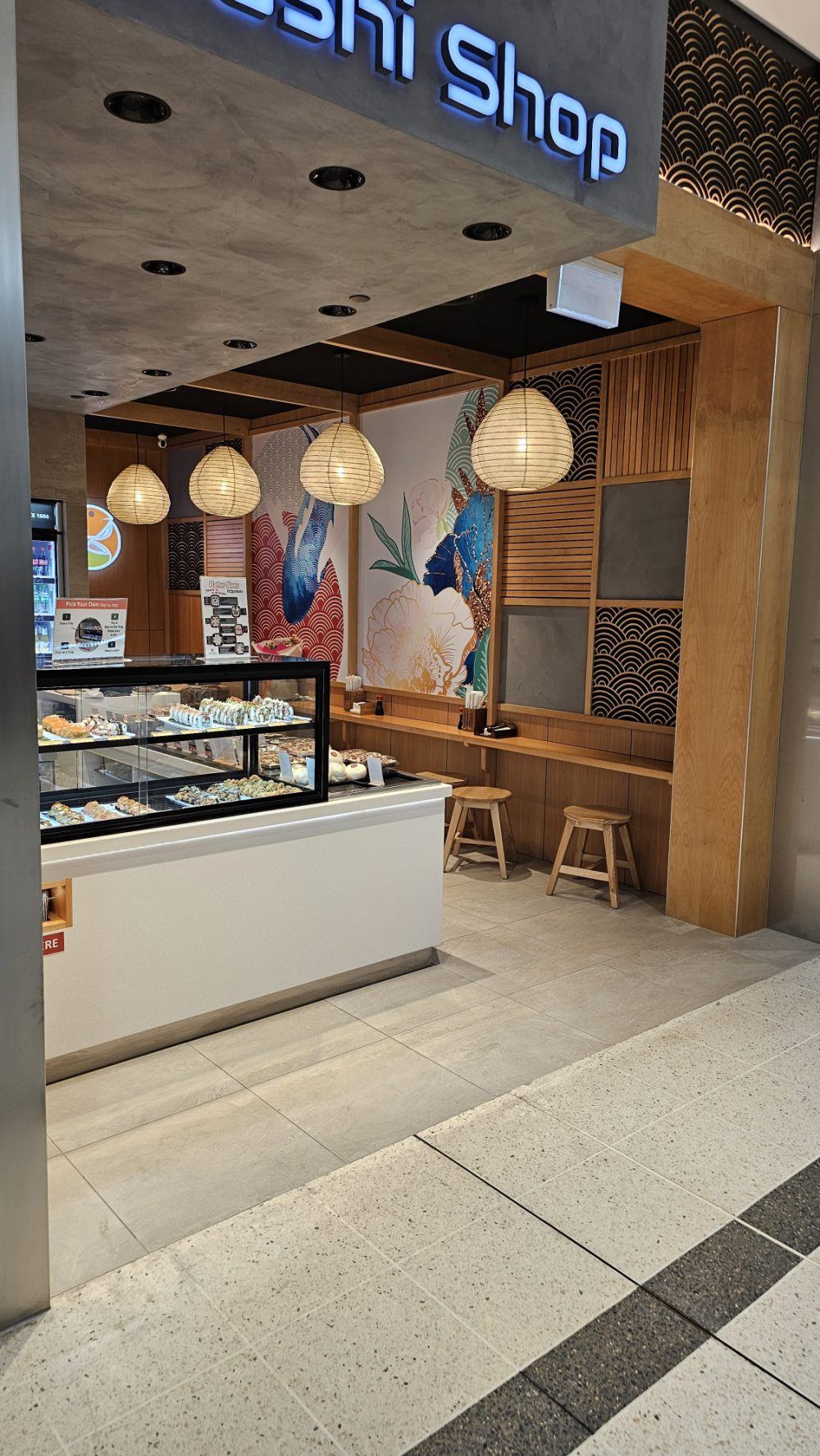 Interior of the Sushi Shop fit-out showing feature ceiling and bespoke aluminium-framed joinery